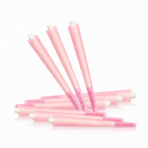 Gatorbeug King Size Pre-Rolled Cones 50 Pack – Pink, loose scattered pink cones on white background