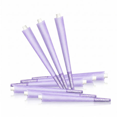 Gatorbeug King Size Pre-Rolled Cones 50 Pack – Purple, loose scattered purple cones on white background
